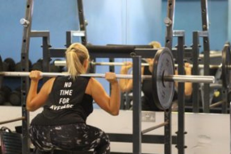 Squatting with a Bar Bell