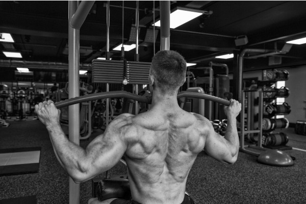 The back of a man utilising weight equipment at the St Michaels Health Club
